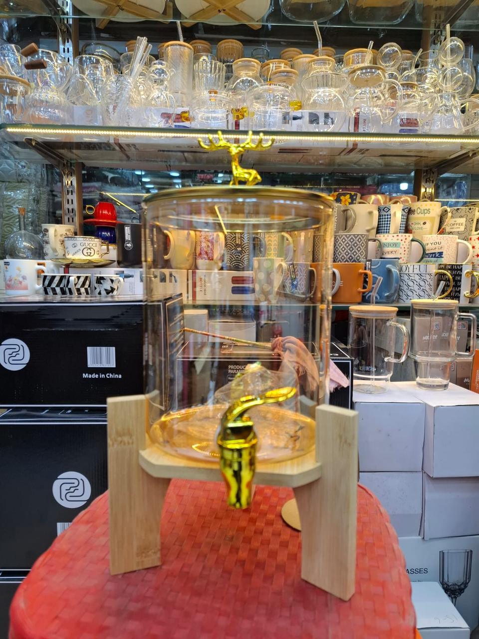 Round Glass Beverage Dispenser - Golden Tap & Wooden Stand - Clarify.pk