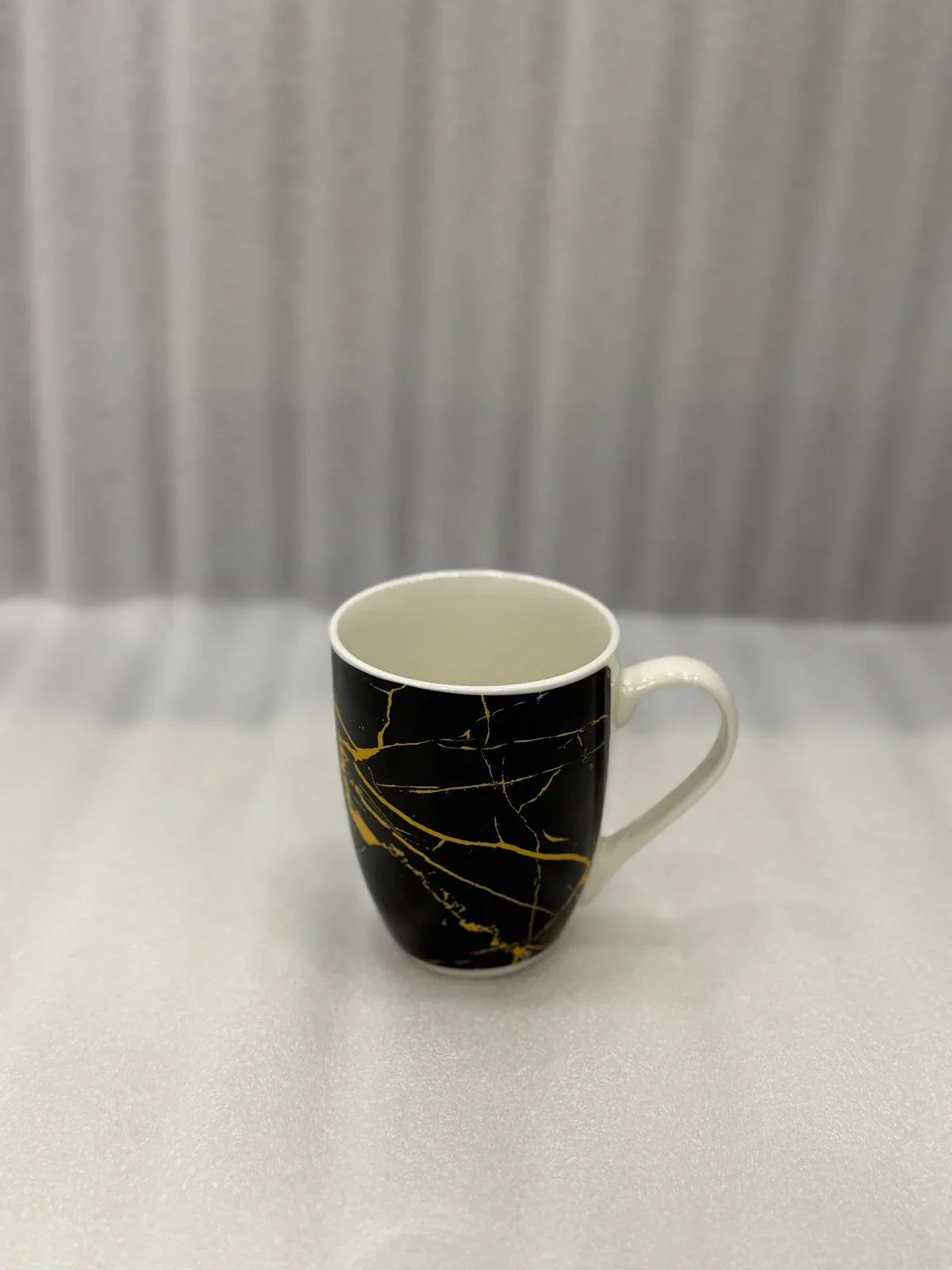 Luxury Marble Pattern Ceramic Mug – Black with Golden Streaks - Clarify.pk
