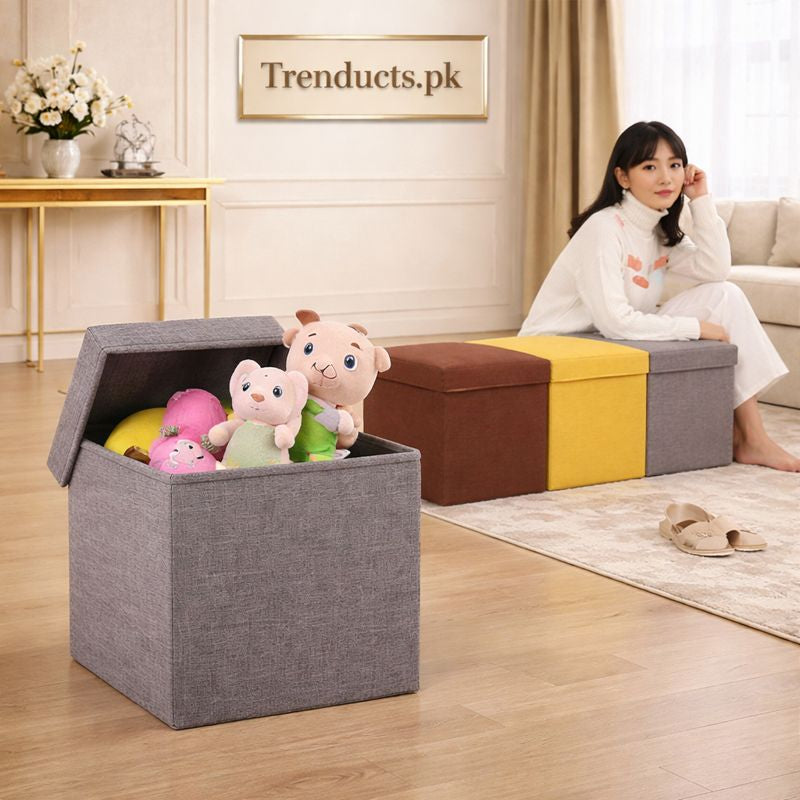 Foldable fabric storage ottoman stool being used for toy storage and as a sturdy seat supporting 130kg