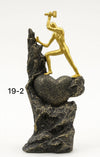 Golden Man on Rock Statue – Modern Fiber Decorative Sculpture - Clarify.pk