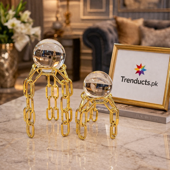 Two gold metal decorative stands with large crystal balls at different heights - Trenducts Pakistan