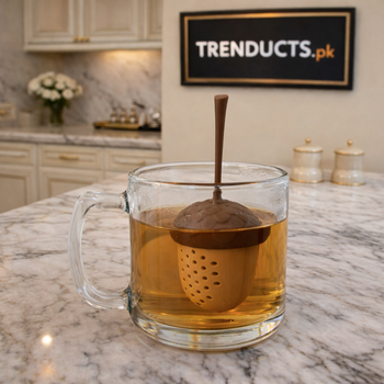 Green leaf-shaped silicone tea infuser with a stainless steel mesh ball for loose-leaf tea.