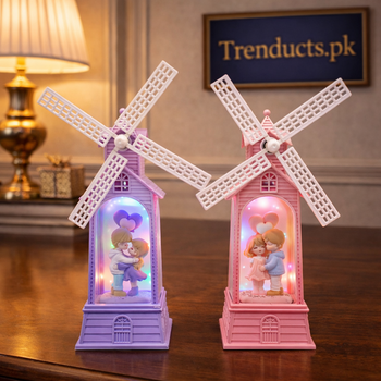 Two romantic Holland-style windmill decorations in pink and purple featuring a miniature couple with LED lights and music - Trenducts Pakistan
