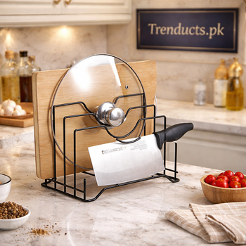 Matte black stainless steel kitchen organizer rack holding a wooden cutting board, glass pot lid, and a large kitchen knife - Trenducts Pakistan