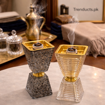 Charcoal grey and honey amber crystal bukhoor burners with geometric textures and gold basins on a decorated wooden table - Trenducts Pakistan