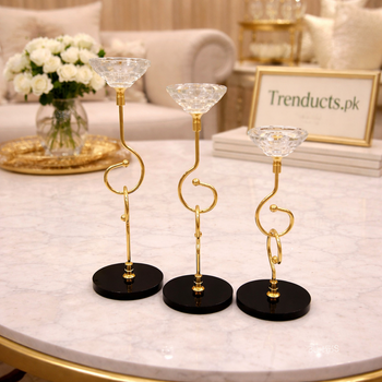 Set of three modern gold candle stands with spiral stems, crystal tops, and black bases in graduated sizes - Trenducts Pakistan