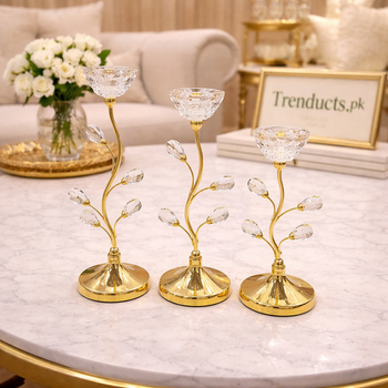 Set of three luxury gold candle stands with crystal teardrop buds and petal-shaped glass tops in graduated sizes - Trenducts Pakistan