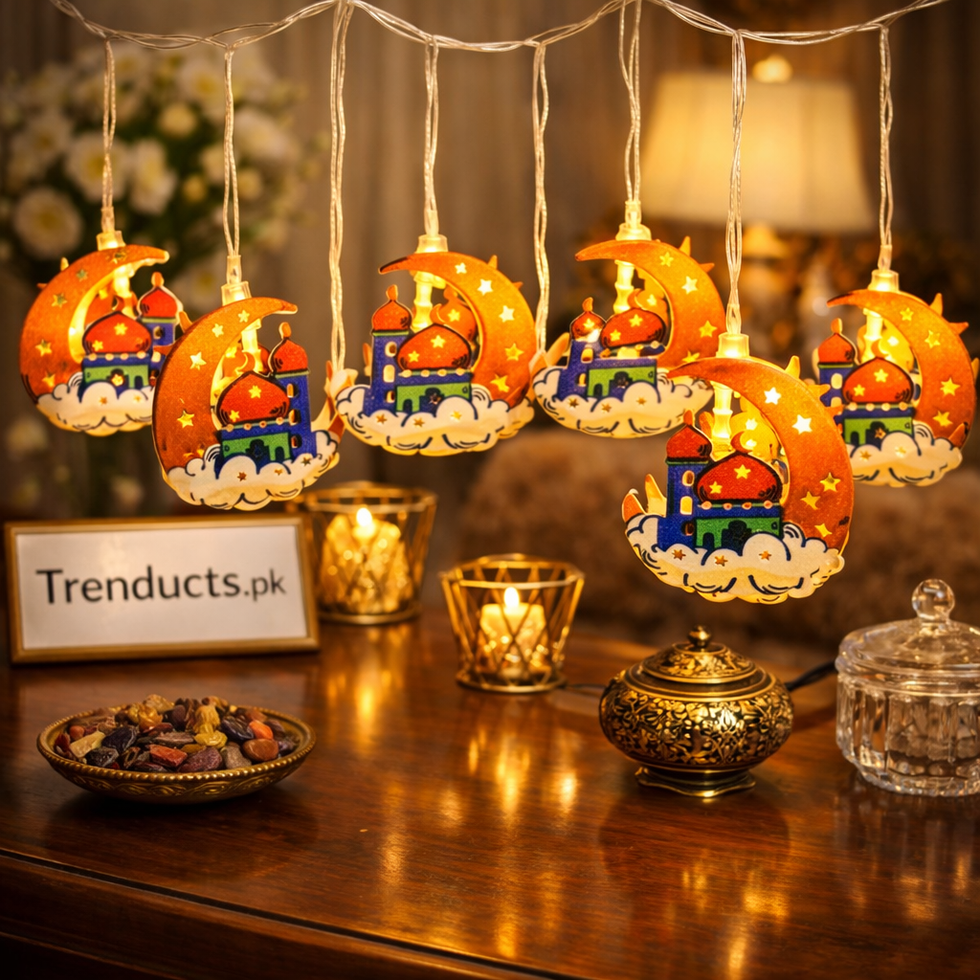 Handheld view of Trenducts Ramadan string lights featuring orange crescent moons and colorful mosque designs with warm LED bulbs.