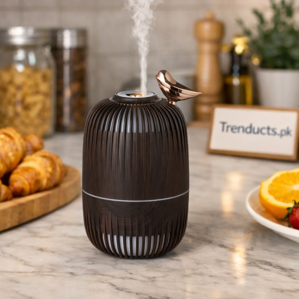 "Trenducts dark wood grain aroma diffuser and mini humidifier with rose gold bird accent."

"Compact electric cool mist humidifier for bedroom and office aromatherapy in Pakistan."