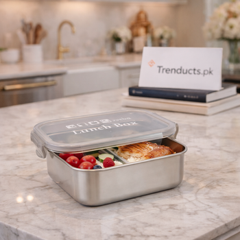 High-quality stainless steel lunch box with a sleek finish, displayed on a clean wooden table.