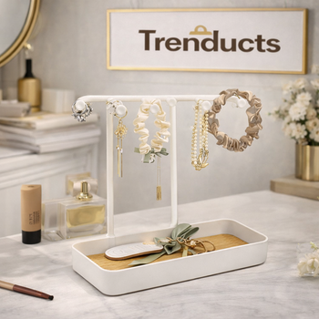 Jewelry organizer display hung on a wall, elegantly holding several necklaces and earrings in a clean, organized manner.