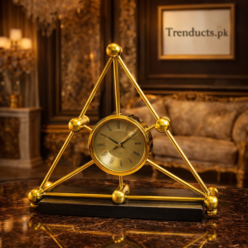 Modern obsidian black and gold molecular desk clock with geometric metal frame on a luxury dark wood executive desk.