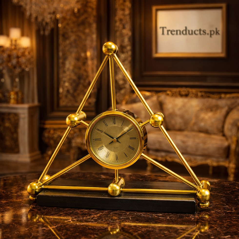 Modern obsidian black and gold molecular desk clock with geometric metal frame on a luxury dark wood executive desk.