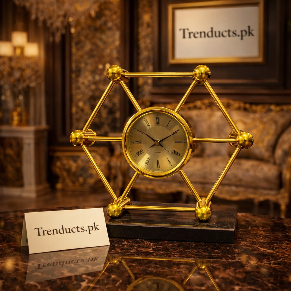 Modern hexagonal gold metal desk clock with a white face and silent movement on a minimalist office desk.