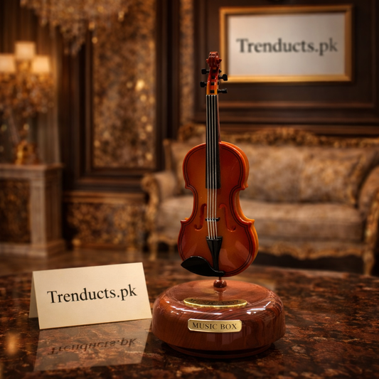 Model 71-2 vintage coffee grinder music box with golden gears and a wood-finished base featuring a small drawer.