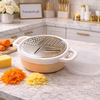 4-in-1 multi-purpose kitchen grater with green frame, interchangeable stainless steel blades, and transparent collection case for vegetable prep.