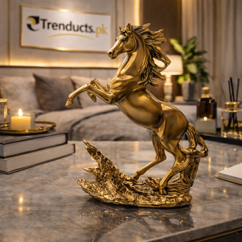 24cm shimmering golden prancing horse statue standing on a white marble mantel in a luxury living room.