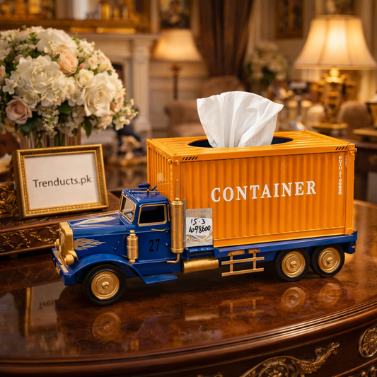 Distressed red vintage cargo truck tissue box on a rustic wooden coffee table.