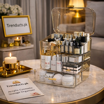 A thick-walled clear acrylic makeup organizer with heavy glass serum bottles on reinforced shelves and lipsticks in precision slots.
