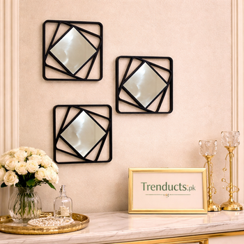 Pack of three modern matte black square wall mirrors with geometric interlocking line frames on a white surface - Trenducts Pakistan