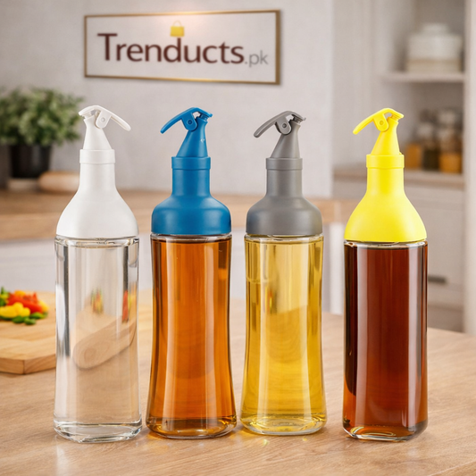Trenducts 500ml clear glass oil dispenser bottle with stainless steel leak-proof spout on a kitchen counter.