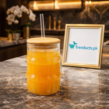 Aesthetic 500ml ribbed iced tea glass with bamboo lid and glass straw on a marble countertop - Trenducts Pakistan