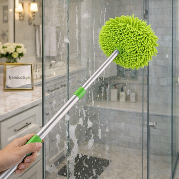An adjustable blue microfiber car wash brush with a long telescoping aluminum handle being used on a clean vehicle.