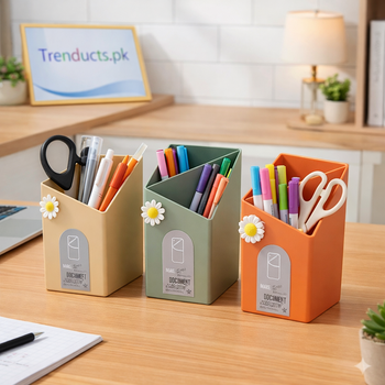 Modern triangular stationery holder on a desk, filled with pens and pencils.