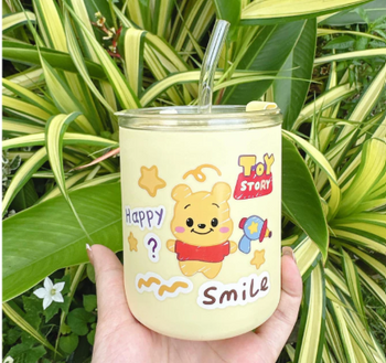 Stylish glass tumbler with a matching glass straw, perfect for a sustainable, aesthetic cold drink experience.