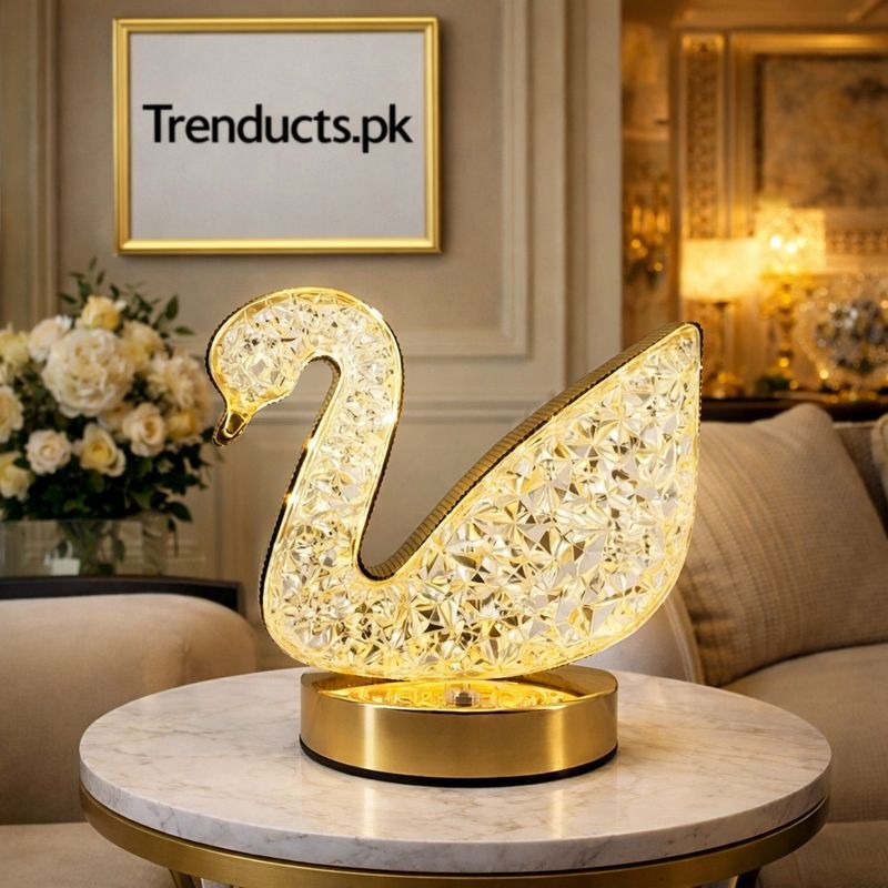 Elegant crystal swan LED table lamp with gold finish base and diamond cut effect