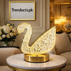 Elegant crystal swan LED table lamp with gold finish base and diamond cut effect