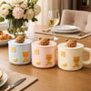 Aesthetic ceramic bear mug with brown silicone lid and gold spoon Trenducts Pakistan
