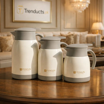 Set of three cream and grey Penguin stainless steel thermal coffee pots on a wooden counter - Trenducts Pakistan