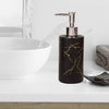 Matte black marble design soap dispenser with gold veining and silver pump on a wooden vanity next to a white sink - Trenducts Pakistan