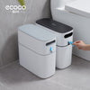 White ECOCO slim narrow trash can placed in a tight gap between a wall and a sofa - Trenducts Pakistan