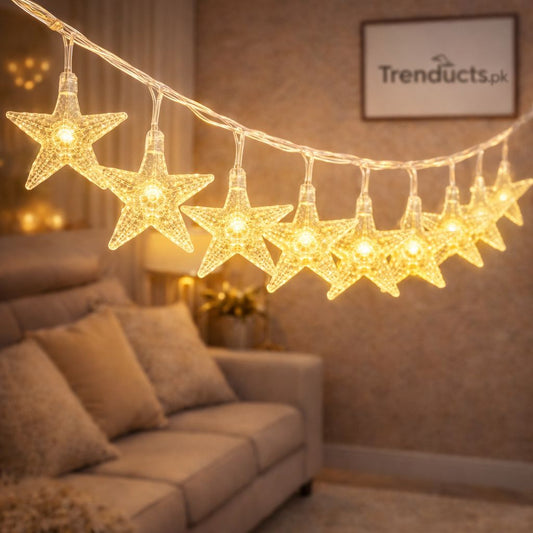 Trenducts crystalline star string lights with warm golden LED glow for living room ambiance."

"Close-up of 3D crystal star-shaped fairy lights for festive bedroom decoration in Pakistan."
