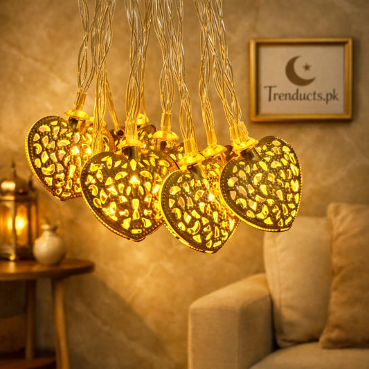 Trenducts heart string lights with warm LED glow for romantic bedroom decoration."

"Close-up of heart-shaped fairy lights for festive home ambiance in Pakistan."