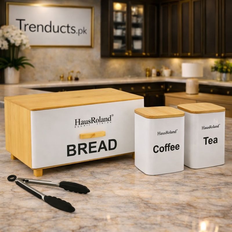 "HausRoland 4-piece matte black bread box and canister set on a modern kitchen counter."

"Stainless steel bread box with matching tea coffee sugar jars for kitchen organization in Pakistan."