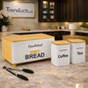 "HausRoland 4-piece matte black bread box and canister set on a modern kitchen counter."

"Stainless steel bread box with matching tea coffee sugar jars for kitchen organization in Pakistan."