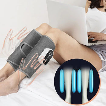 Grey electric air compression calf massager wraps on a person's legs with a handheld controller on a sofa.