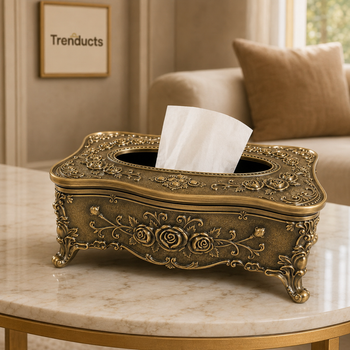 Antique bronze floral tissue box displayed on marble console