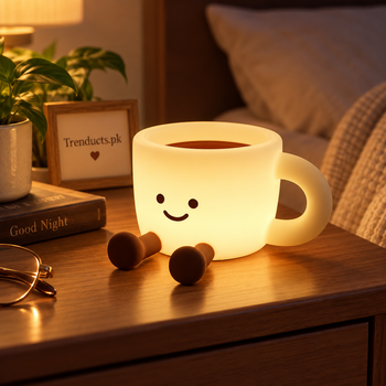 Rechargeable coffee cup silicone night lamp glowing on a bedside table