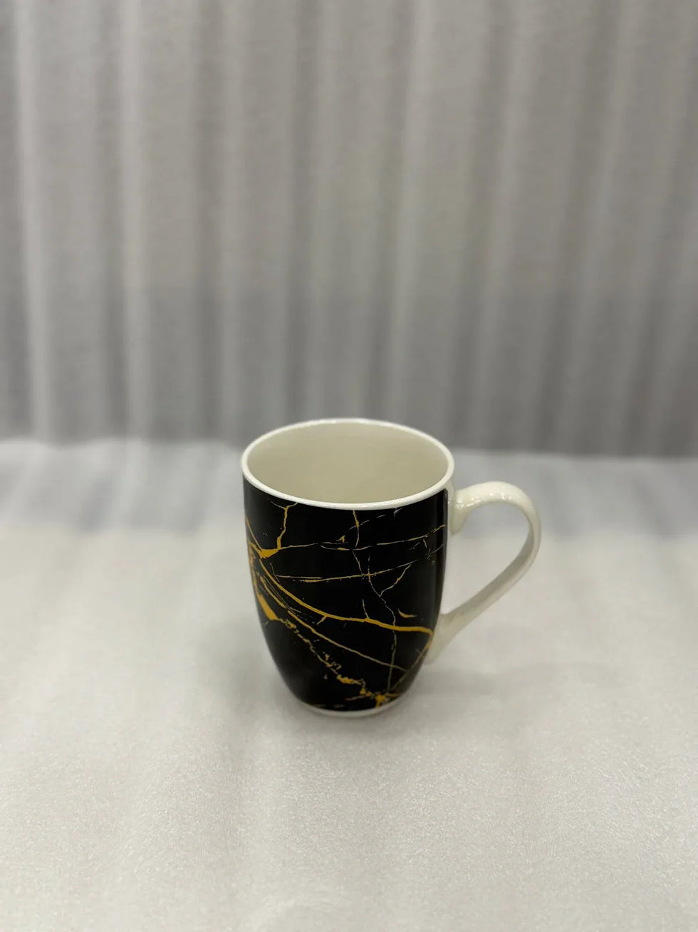 Luxury Marble Pattern Ceramic Mug – Black with Golden Streaks - Clarify.pk