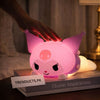 Pink Kuromi lying posture silicone night light glowing on a bed with touch sensor demonstration.