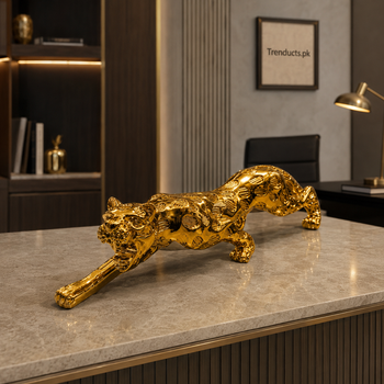 Eleven-inch golden leopard statue on a luxury office console