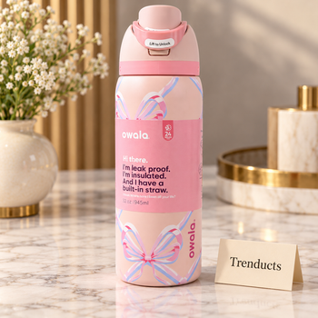 Owala Water Bottle 32 oz in pink with a pastel bow print on a white marble studio surface | Trenducts