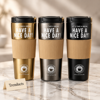 Gold vacuum coffee cup with silicone grip on white marble | Trenducts