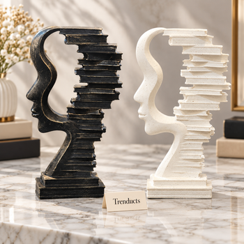 Face Sculpture Book Stack in Black and White on a white marble surface | Trenducts