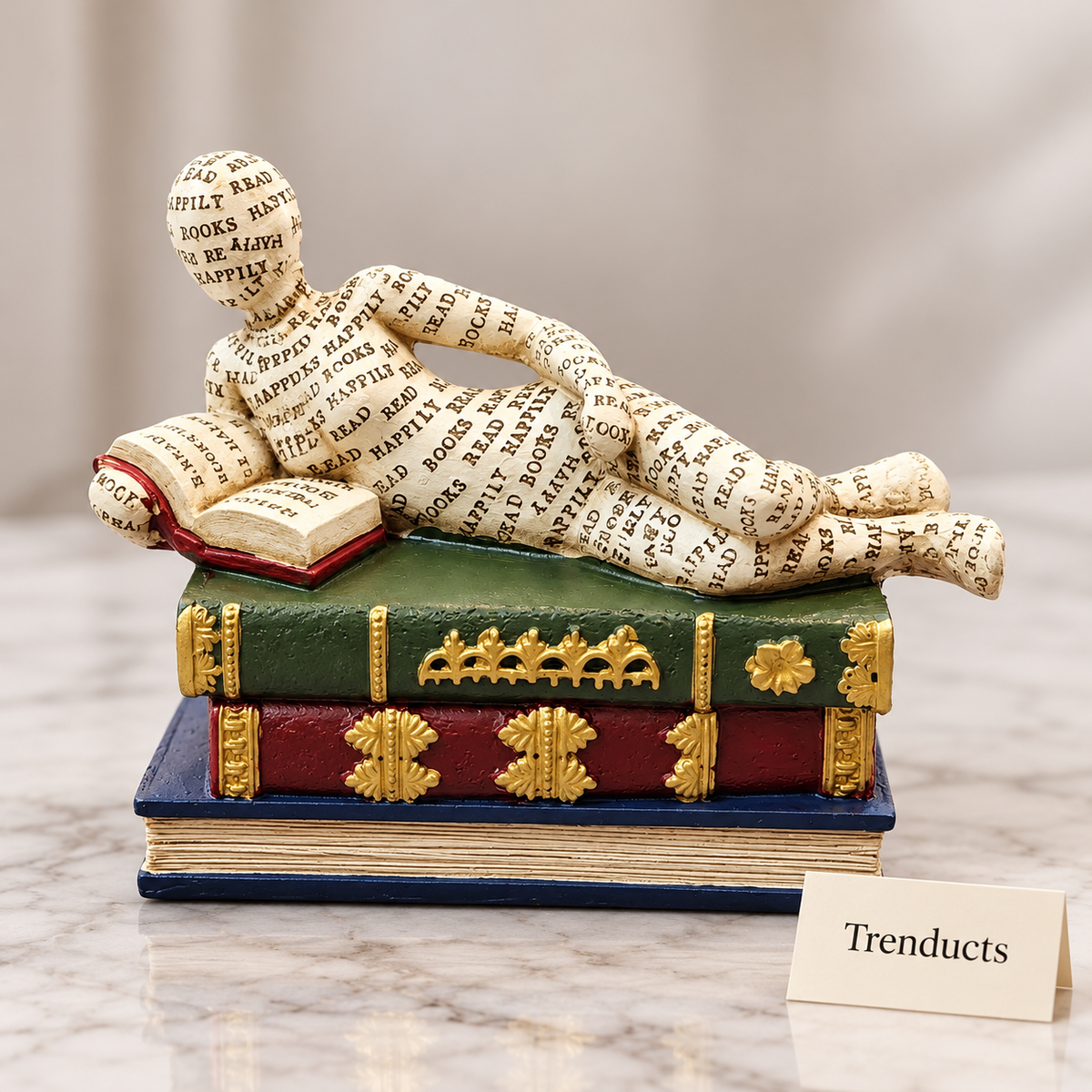 Reclining Reader Figure Showpiece - Newsprint on Book Stack