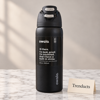 Owala Water Bottle 32 oz in an all matte black finish on a white marble studio surface | Trenducts